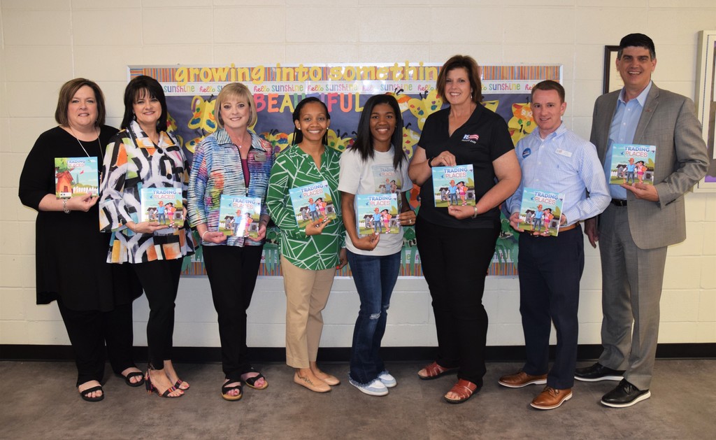 Peoples Bank representatives donate copies of Shanae Williams' children's book to Walker Pre-K Center 